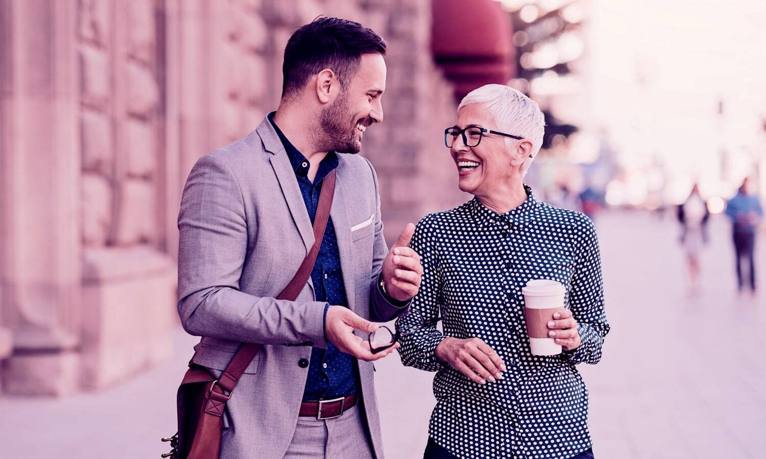 Photograph of two people having a friendly conversation